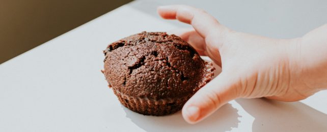 Child Reaches For Chocolate Muffin