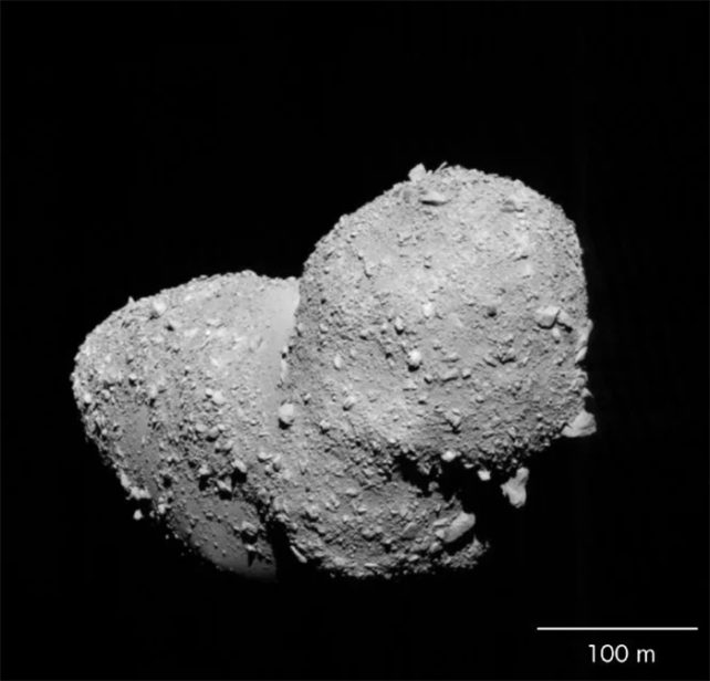 Gray image of an asteroid shaped like a peanut