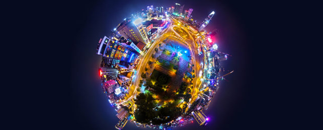 little world effect on a night time view of a city against a dark sky