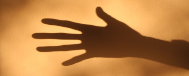 Shadow Of Outstretched Hand