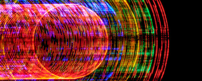 A tubular swirl of laser lights.