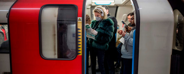 Commuters on a train in the London Underground.