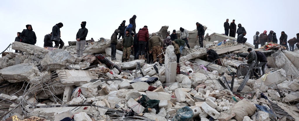 Crowd Of People On Earthquake Rubble