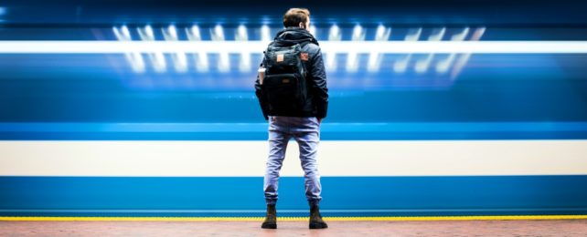 Man On Platform As Train Whizzes Past