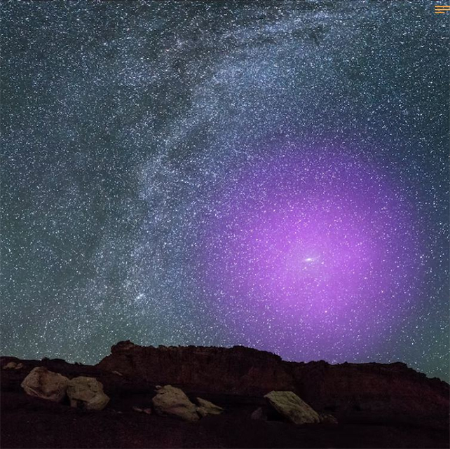 purple haze surrounding a bright andromeda in the night sky over a horizon on Earth