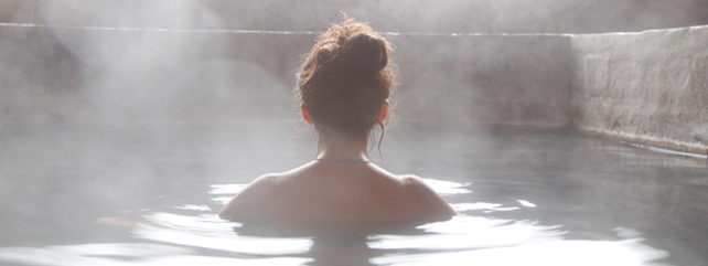 back of a woman's head in a hot tub