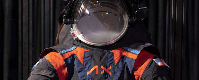 Close up of helmet and dark black and blue spacesuit with orange accents