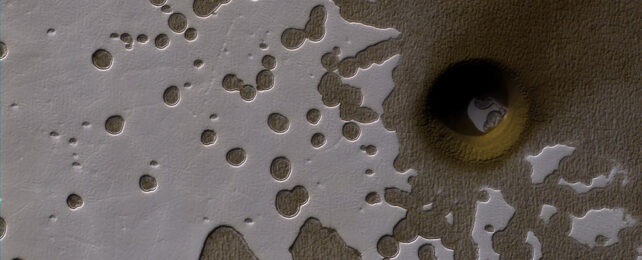 The spotted, Swiss cheese-like terrain of Mars's south pole.