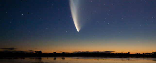 Comet with tail in the night sky