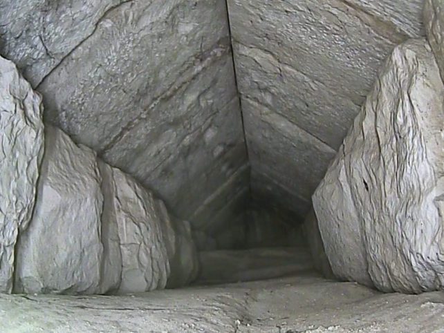 view down the newly found corridor, with peaked ceiling of chevron blocks