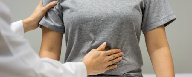 Doctor Examines Patient's Gut