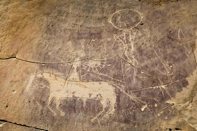 Petroglyphs depicting a horse and rider.