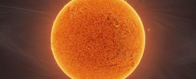 Image of red-orange Sun against black backdrop of space.
