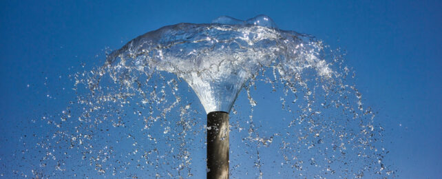 Water gushing from a pipe.