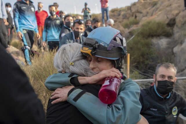 Women hugs relative after emerging from 500 days in a cave