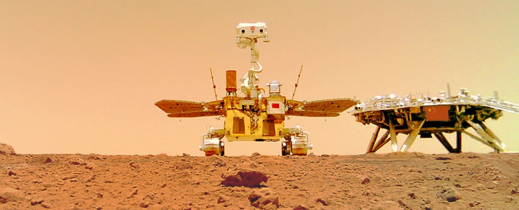 China's first Mars rover Zhurong with its landing platform, Tianwen-1 lander, pictured on the surface of Mars.