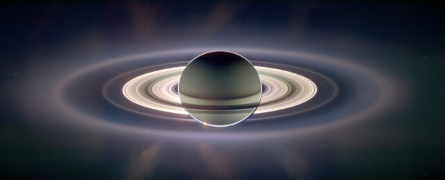 Saturn and its rings glowing from being backlit by the sun
