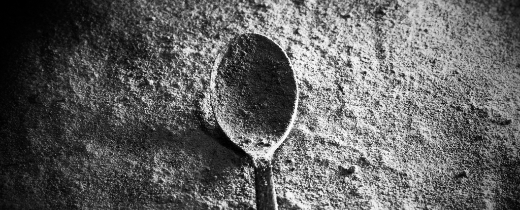 Spoon With White Powder In Dark Room