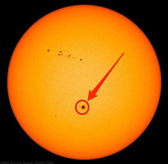 Sunspot circled in red, with arrow pointing to it.