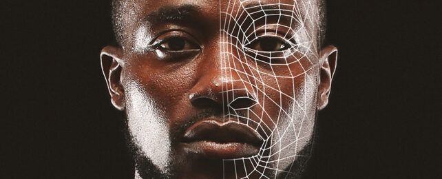 black man's face with a grid of white lines over half of his face