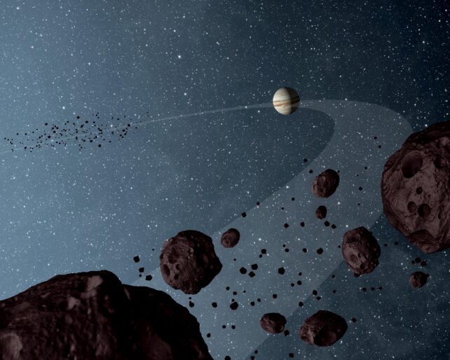 Artist's diagram of Jupiter in orbit and some Trojan asteroids nearby the gas giant. 