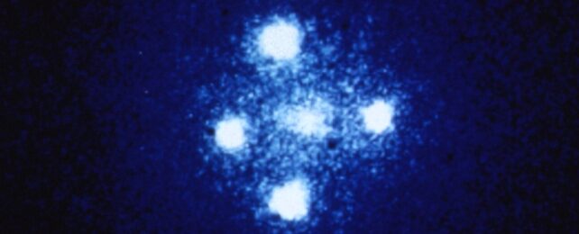 Four bright areas appearing around a center brightness, creating a cross like brightness on a dark blue background