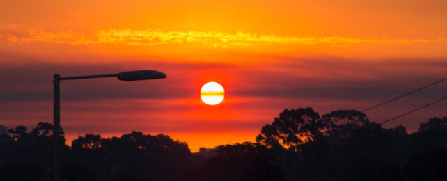 Red sun on hot day