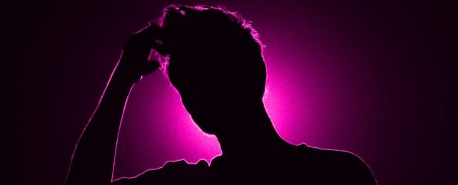 Lonely People's Brains Work Differently, New Evidence Shows MansHeadInPurpleLight-642x260