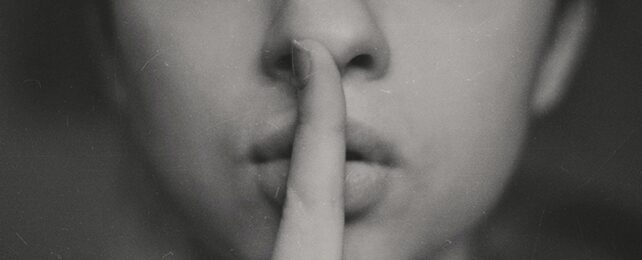 Woman Makes Shh Gesture