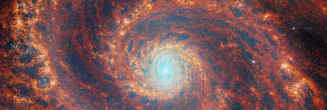 Spiral galaxy with blue glow at the center