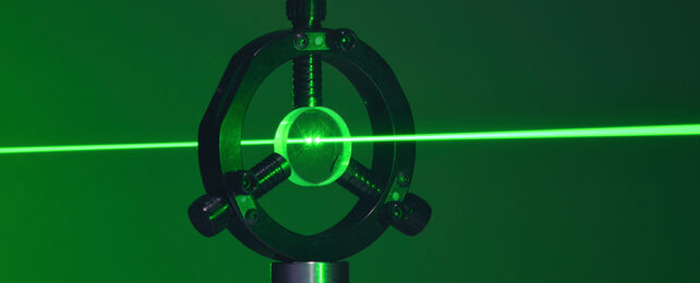 green laser light passing through a lens