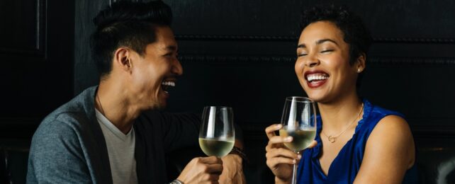Couple Drink Wine In Bar
