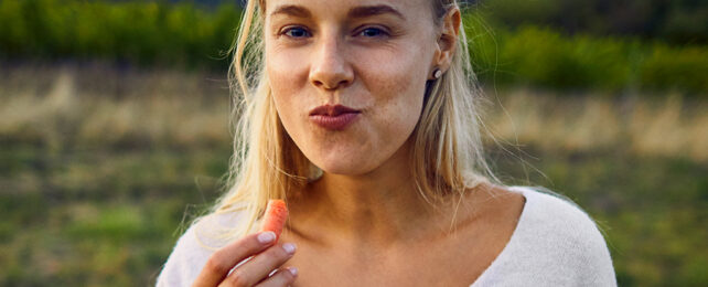 woman eating carrot