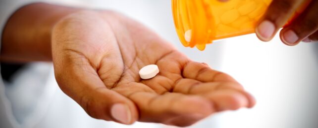 Hand Holding a pill