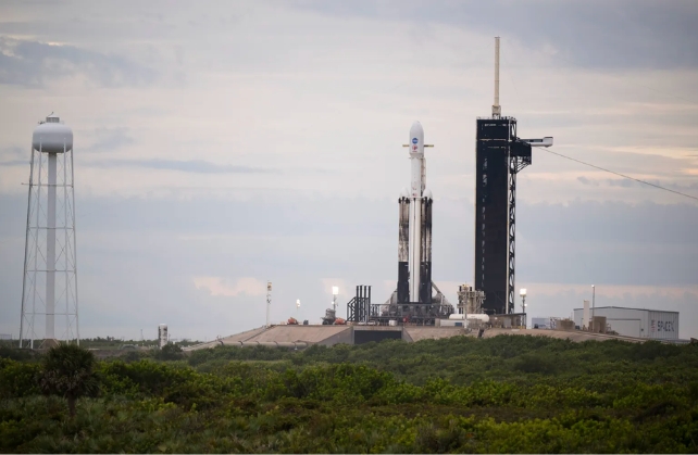A SpaceX Falcon Heavy rocket with the Psyche spacecraft onboard is seen at Launch Complex 39A