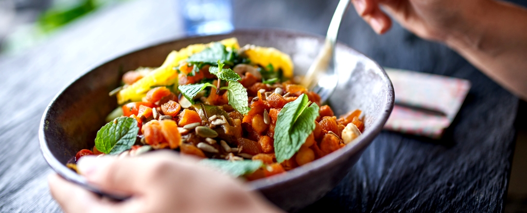 Person Eats From Bowl Of Food