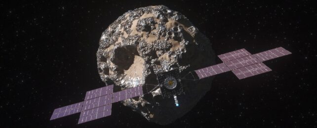 An illustration of NASA's Psyche spacecraft approaching an asteroid