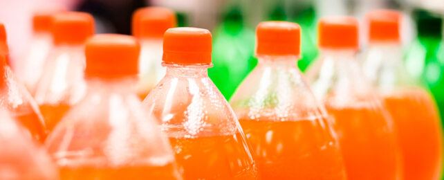 bottles of orange colored soda
