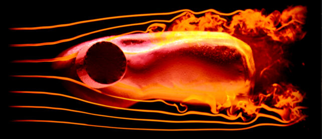 chunk of orange clay with lines indicating movement of water flow around it