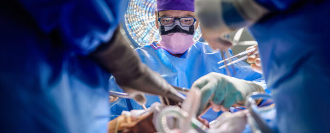 looking up at surgeons during the operation