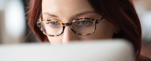 Woman Looks At Computer