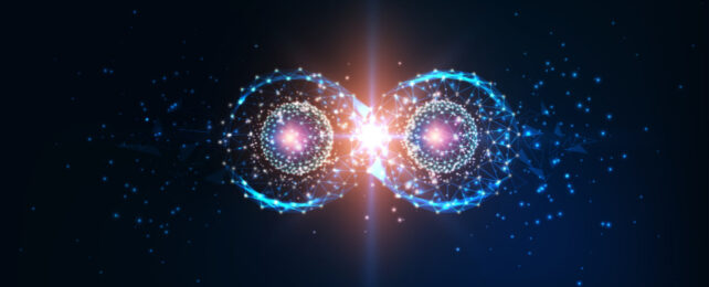 Illustration of two particles with circular auras positioned side by side, with point of light in between them.