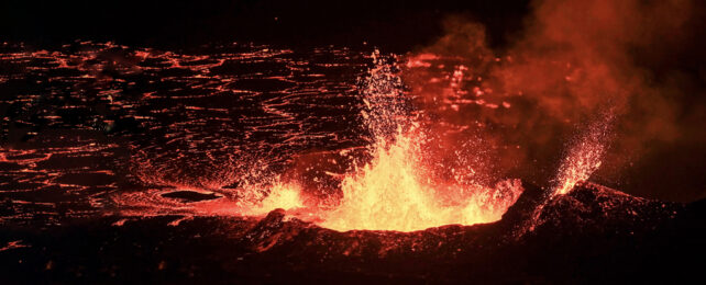 Burst of molten lava against black background.