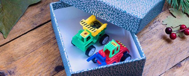 plastic trucks in a gift box for christmas