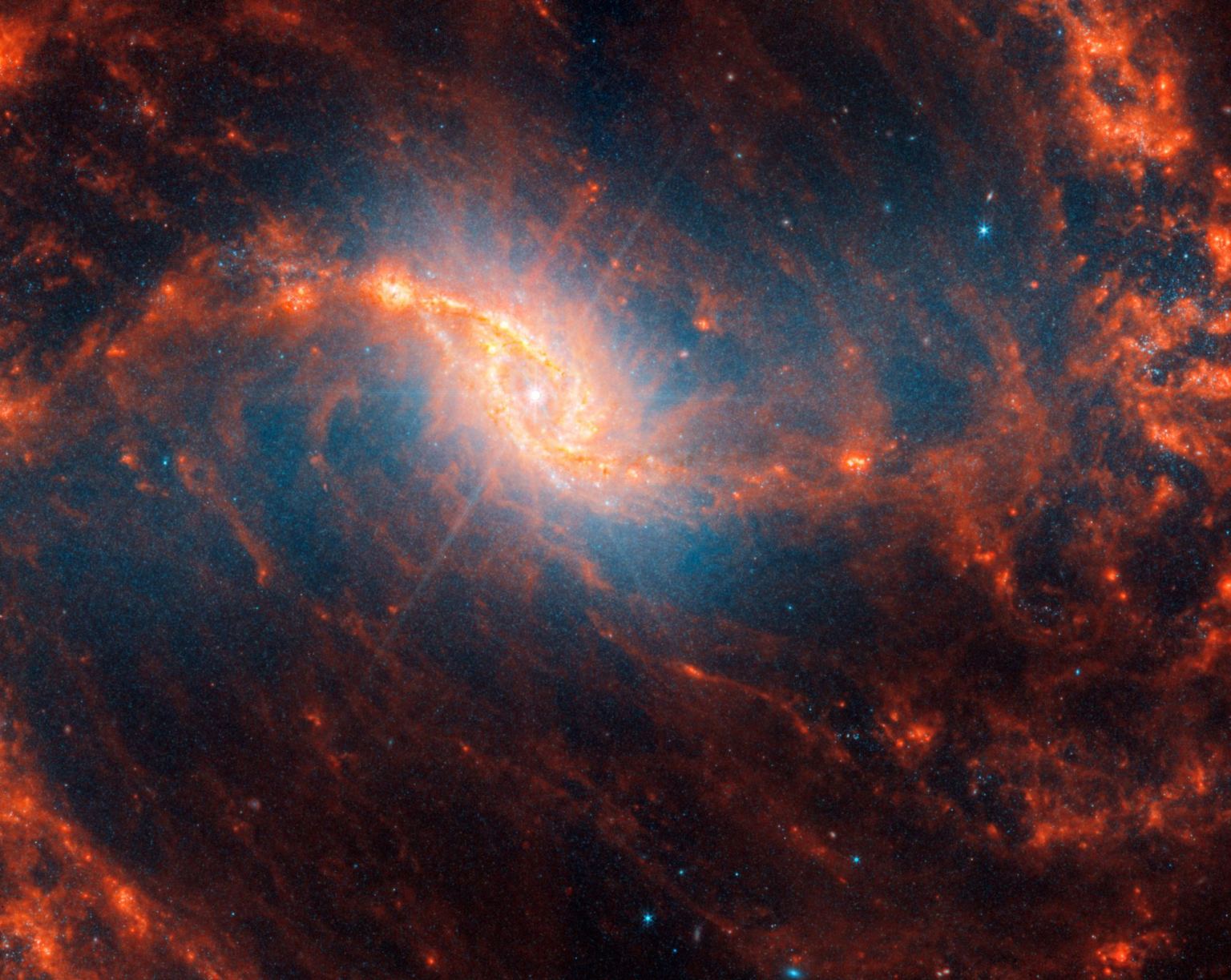 Κεντρική λεπτομέρεια σπειροειδούς γαλαξία με λάμψη φακού σαν αιχμές στο κέντρο