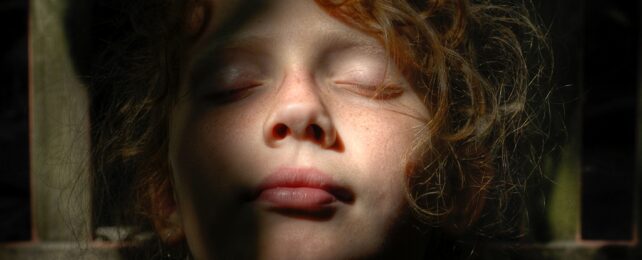 Young Person Relaxes In Sunlight