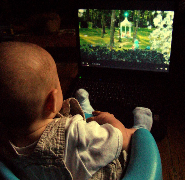 a baby watching tv