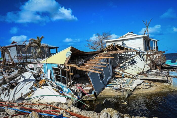 Demolished homes and scattered debris