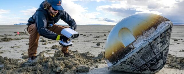 Man Analyses Capsule In Desert