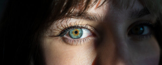 woman with brown-flecked blue eyes